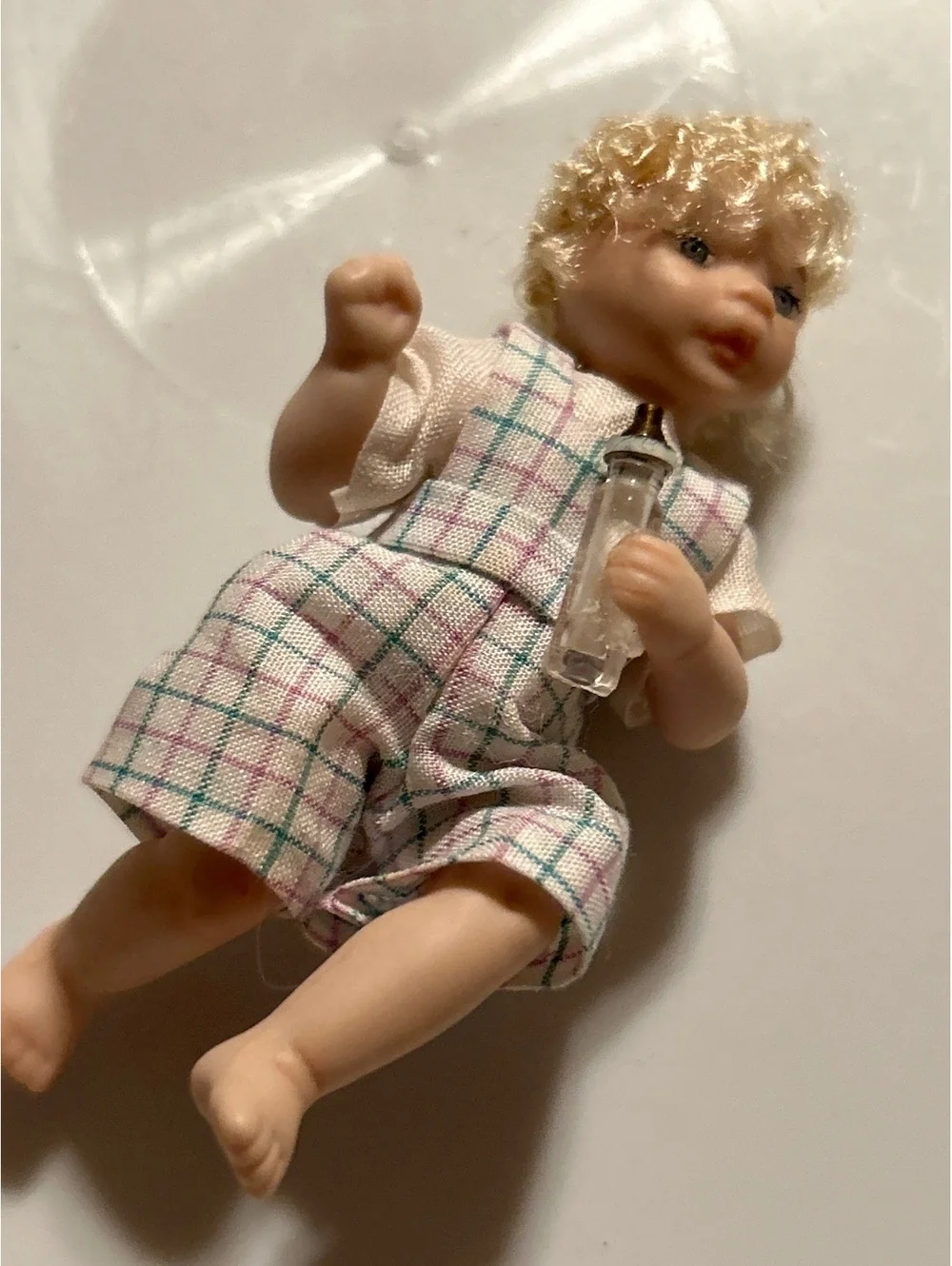 Miniature Baby Doll with Curly Blonde Hair and Checkered Outfit